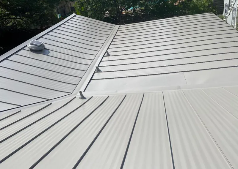Solar attic fan installed on a metal roof for Roof Ventilation in West St. Paul